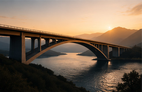 Bridge over river at sunset